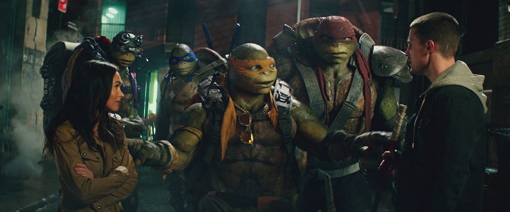 Left to right: Megan Fox as April O'Neil, Donatello, Leonardo, Michelangelo, Raphael and Stephen Amell as Casey Jones in Teenage Mutant Ninja Turtles: Out of the Shadows from Paramount Pictures, Nickelodeon Movies and Platinum Dunes